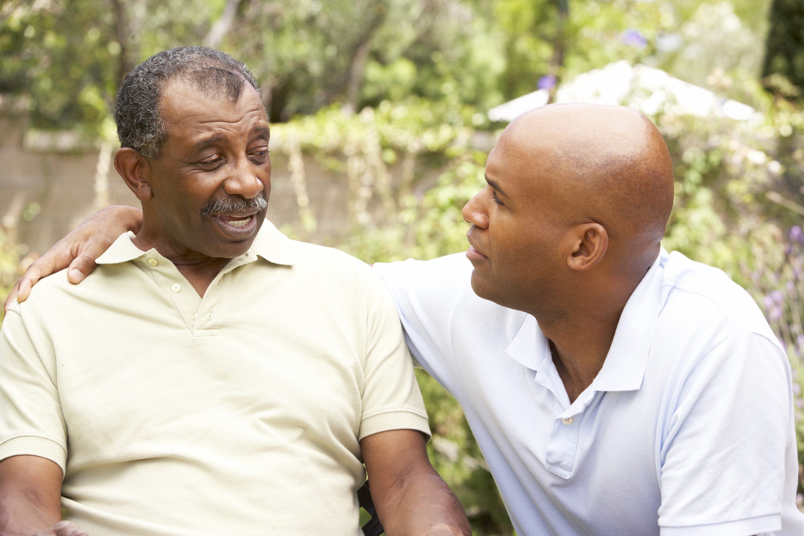 A father and son discuss elder mediation plans before they talk to an elder mediation attorney in Rochester NY